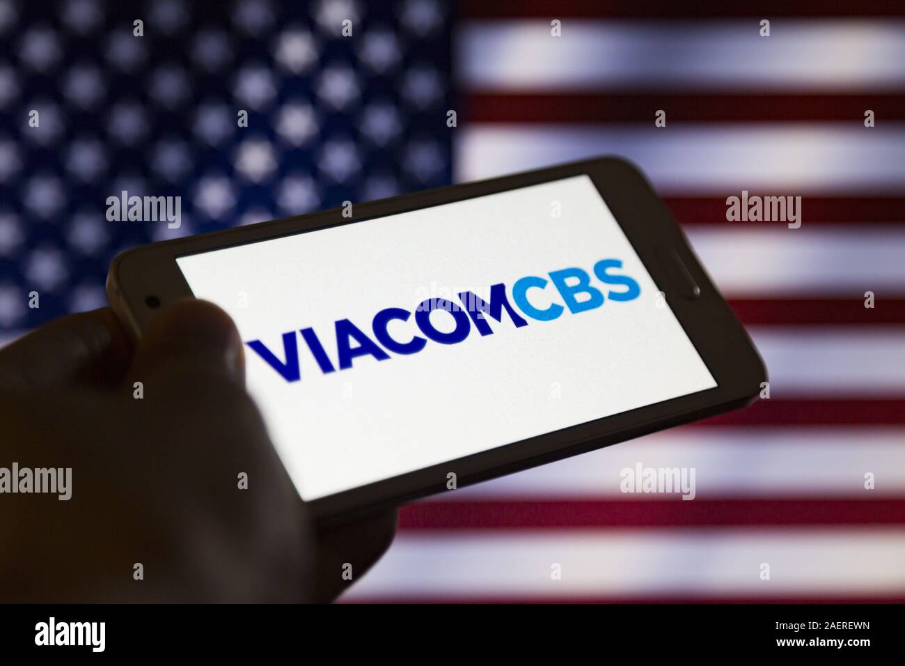 Asuncion, Paraguay. 10th Dec, 2019. Logo of ViacomCBS, a global media and entertainment company based in New York City, is seen on a smartphone screen against United States flag unfocused and partly displayed on background. Credit: Andre M. Chang/ZUMA Wire/Alamy Live News Stock Photo