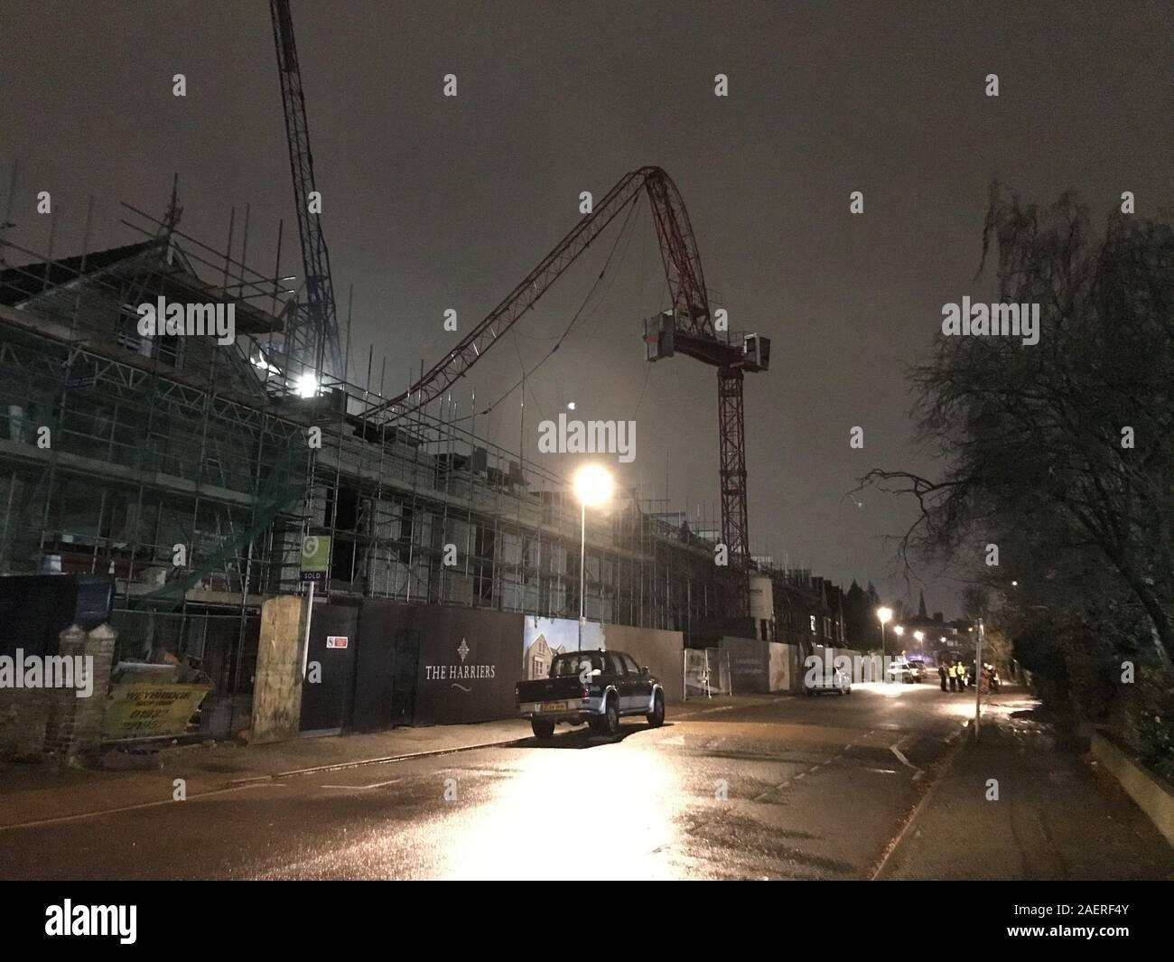 The scene at Fassett Road in south London, where a crane partially