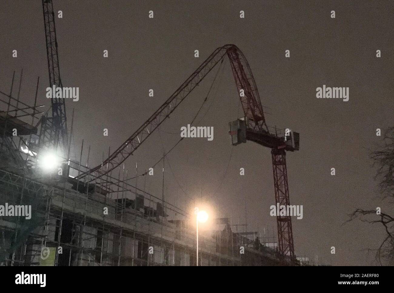 The scene at Fassett Road in south London, where a crane partially