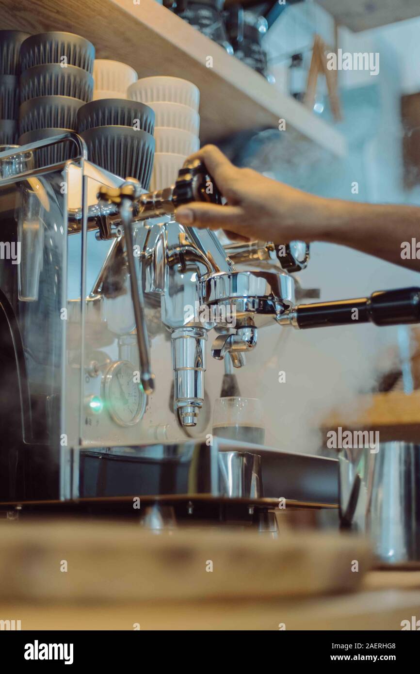 Barista steams with coffee maker in cafe Stock Photo Alamy