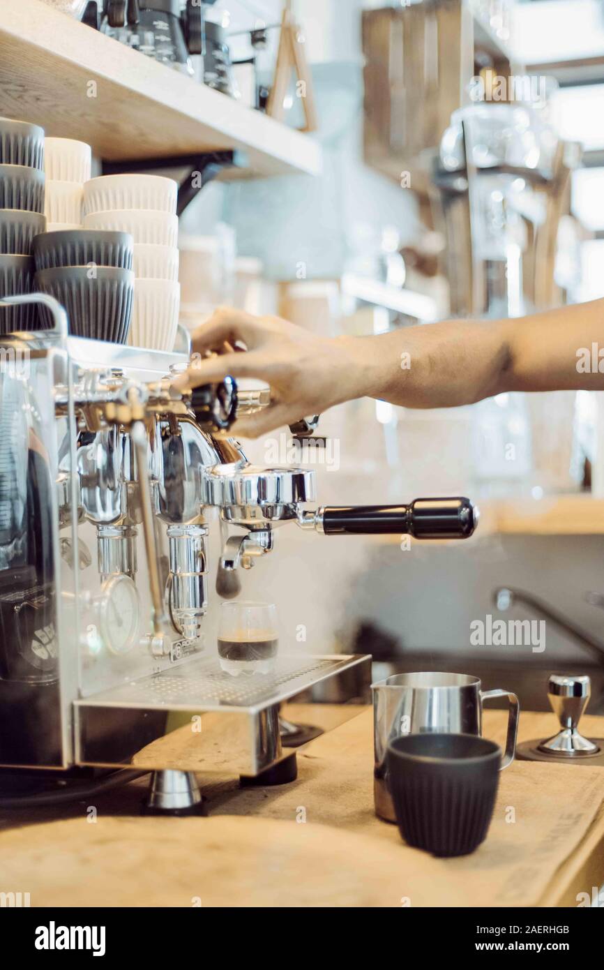 Barista steams with coffee maker in cafe Stock Photo Alamy