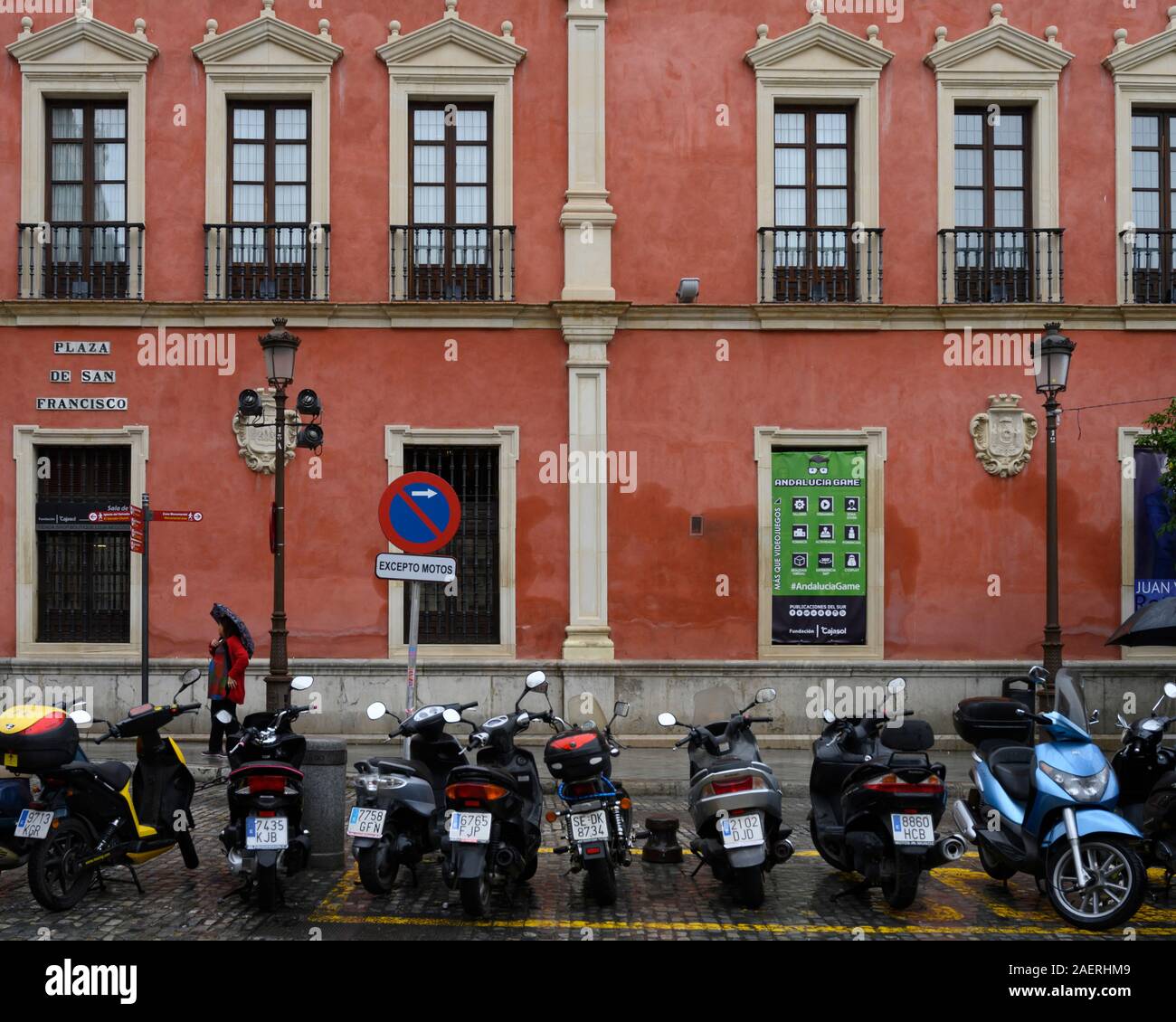 Motorcycles parked on the street, Seville, Seville Province, Spain