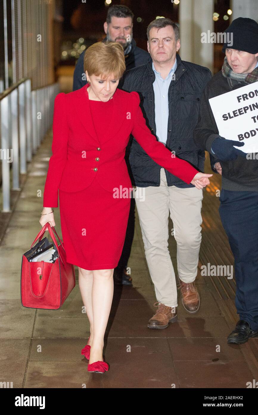 Glasgow, UK. 10 December 2019. Pictured: (in red) Niccola Sturgeon MSP - First Minbister of Scotland and LEader of the Scottish NAtional Party (SNP); (right), Sean Clerekin and Ryan Randall from the Scottish Tennants Organisation.  The Scottish Tennants Organisation have asked all the party leaders for more winter night shelters for the homeless in Glasgow and Scotland and to reverse the homeless cuts in Glasgow. Credit: Colin Fisher/Alamy Live News Stock Photo