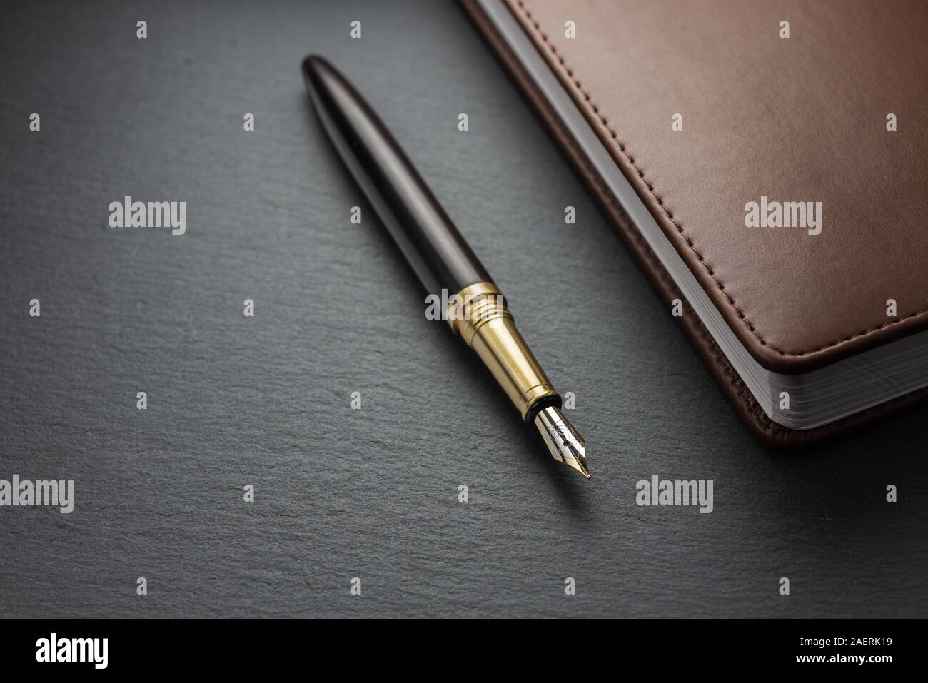 Office table with notepad, keyboard and fountain pen Stock Photo Alamy