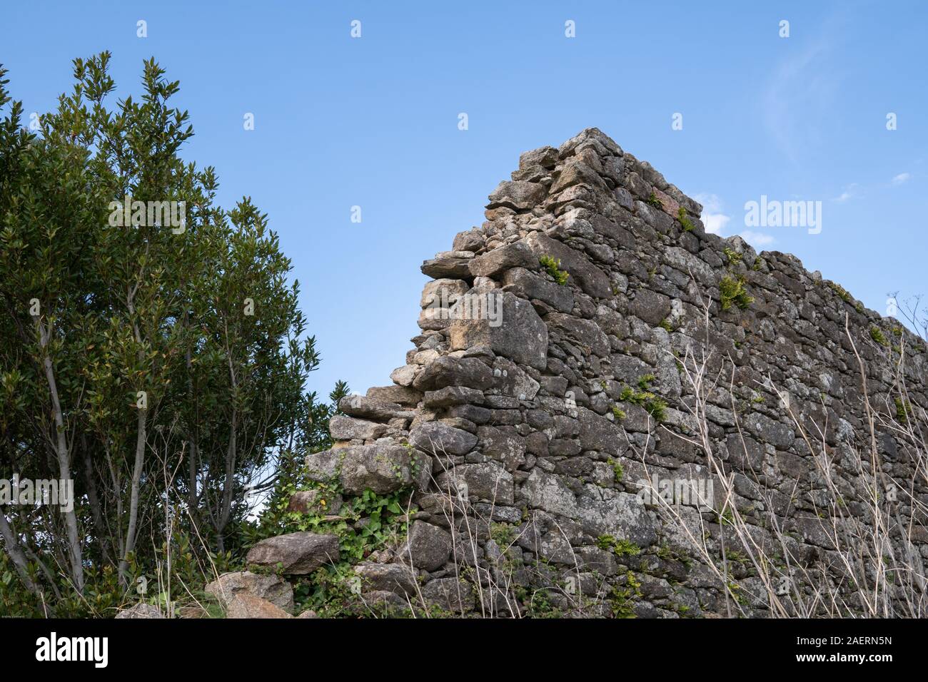 Dry masonry Stone wall. Old ruined stonework wall. Copy space Stock Photo