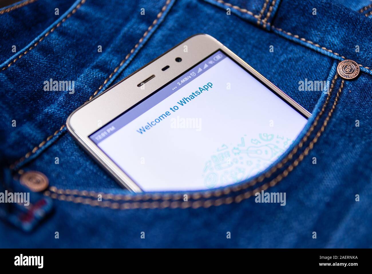 Whatsapp icon on smartphone screen in jeans pocket. Cheboksary, Russia, 02/17/2019 Stock Photo