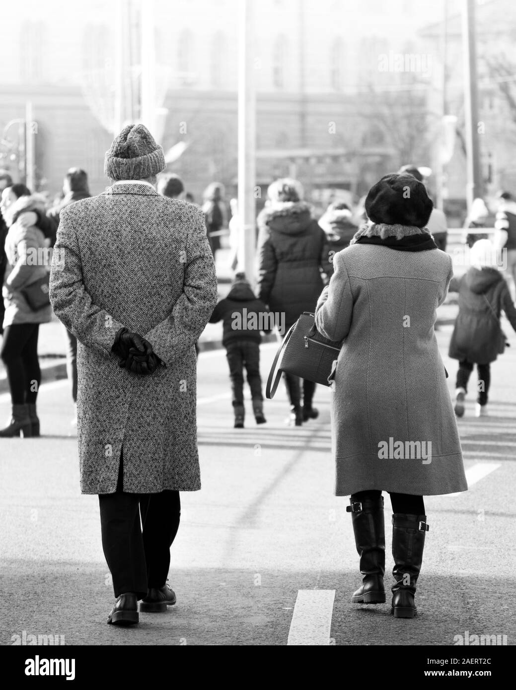 couple of old people walking on the street Stock Photo