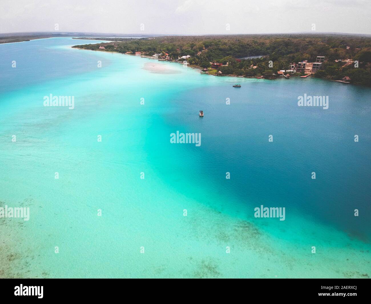 Bright Blue Turquoise Drone Aerial shot of Bacalar, Mexico Lagoon Stock Photo