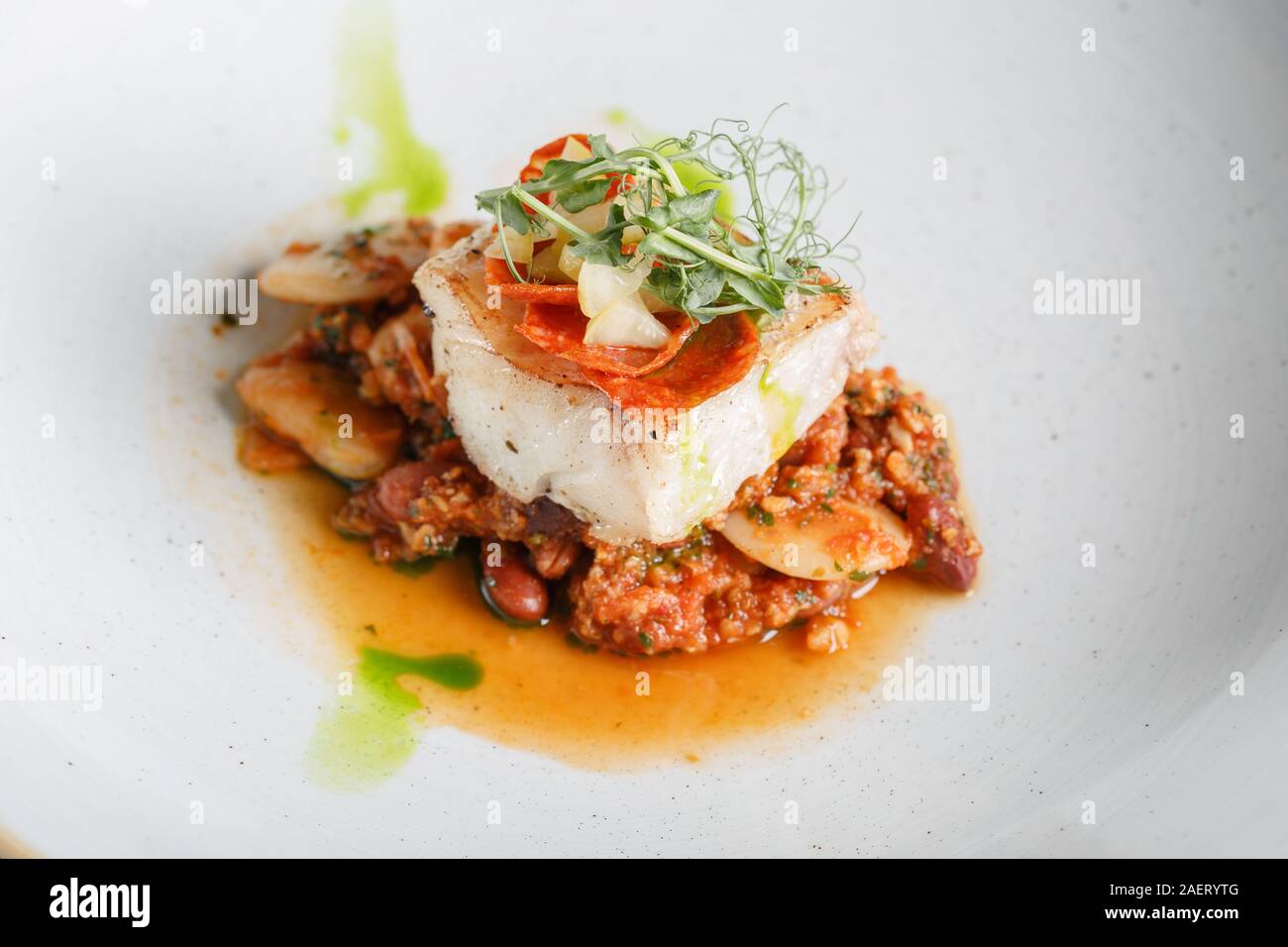Codfish fillet with beans. Stock Photo