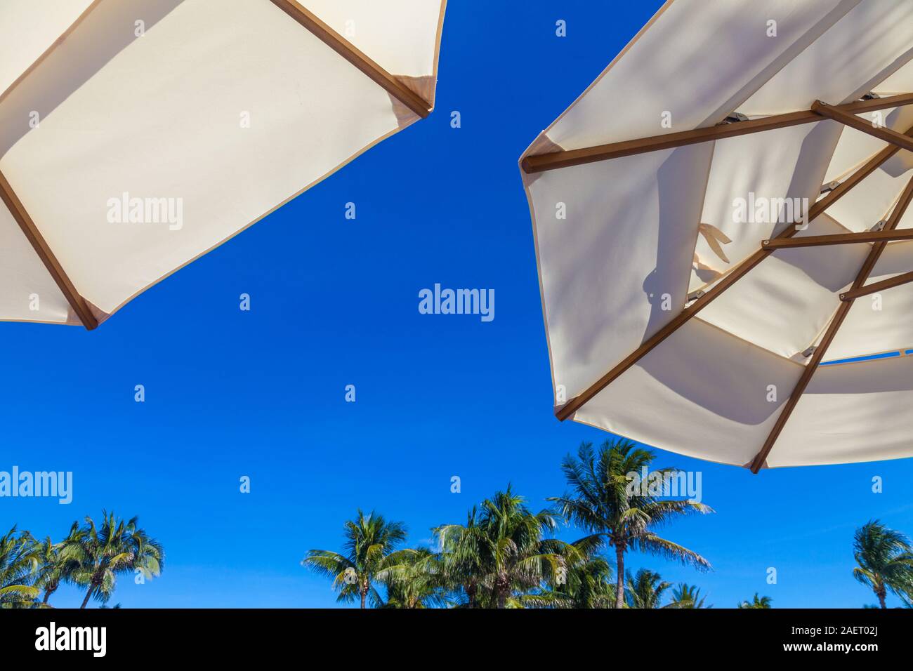 Abstract image of umbrellas against a vivid blue sky at a luxury reort