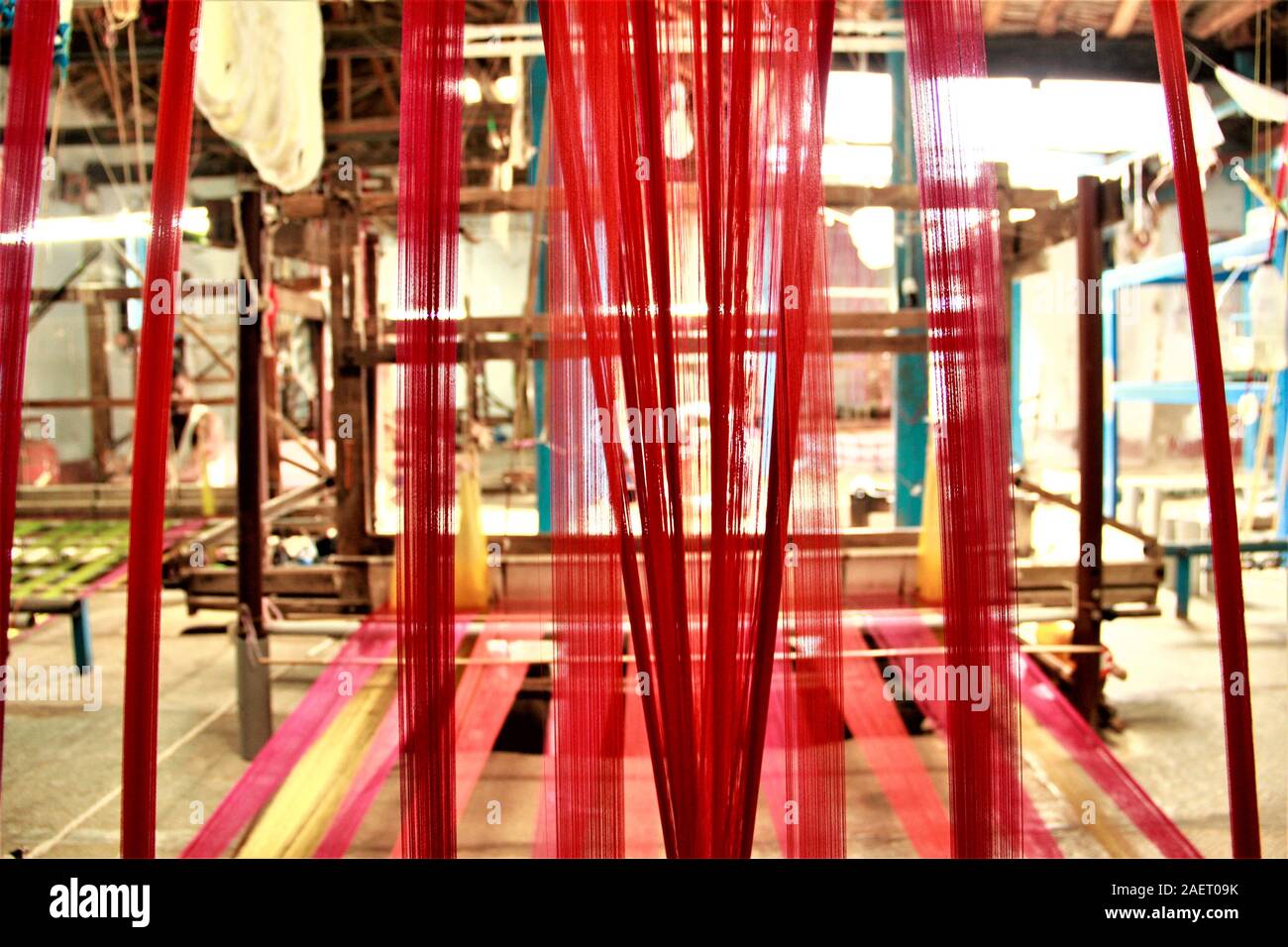 Colorful silk threads used in Indian hand looms. Hand looms are known for their richness, exquisiteness, variety and fine quality. Stock Photo