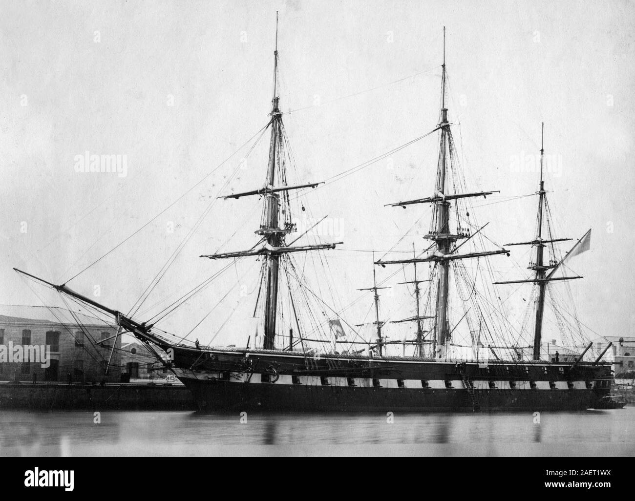 HMS Liverpool, 1861 in Bermuda or Barbados, she was a fourth-rate frigate of the Royal Navy. She was ordered on 31 March 1855, but building did not commence until 14 November 1859 and she was launched at Devonport Dockyard on 30 October 1860, in the same year that the famous iron-hulled Warrior was launched. Stock Photo