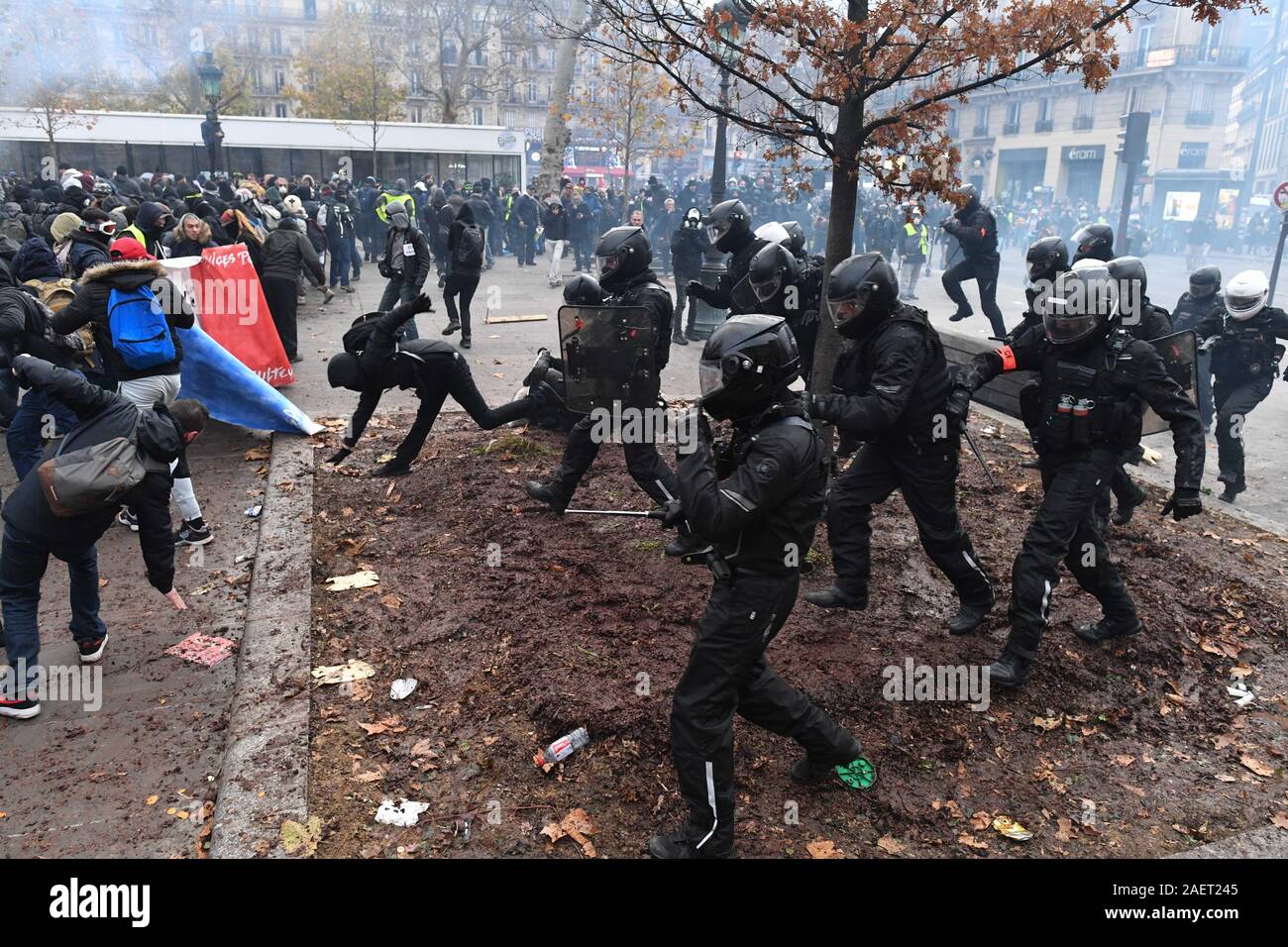 *** STRICTLY NO SALES TO FRENCH MEDIA OR PUBLISHERS *** December 05, 2019 - Paris, France: French police clash with anti-government protesters ahead of a demonstration against the President Emmanuel Macron's pension reform plan. Tens of thousands of people marched in Paris to voice their opposition to the government's project. Stock Photo