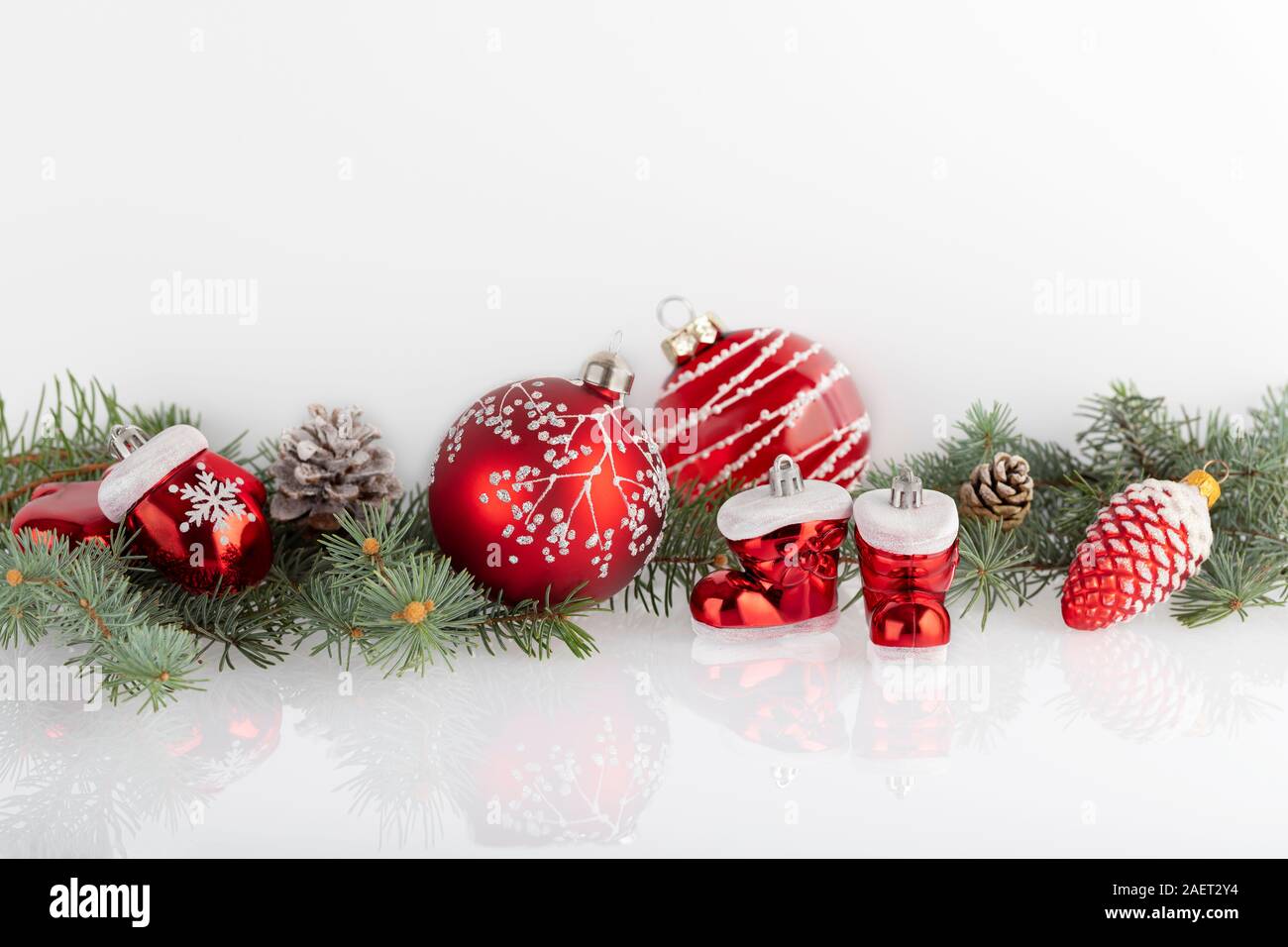 Christmas decoration baubles and cones with branches of fir tree on ...