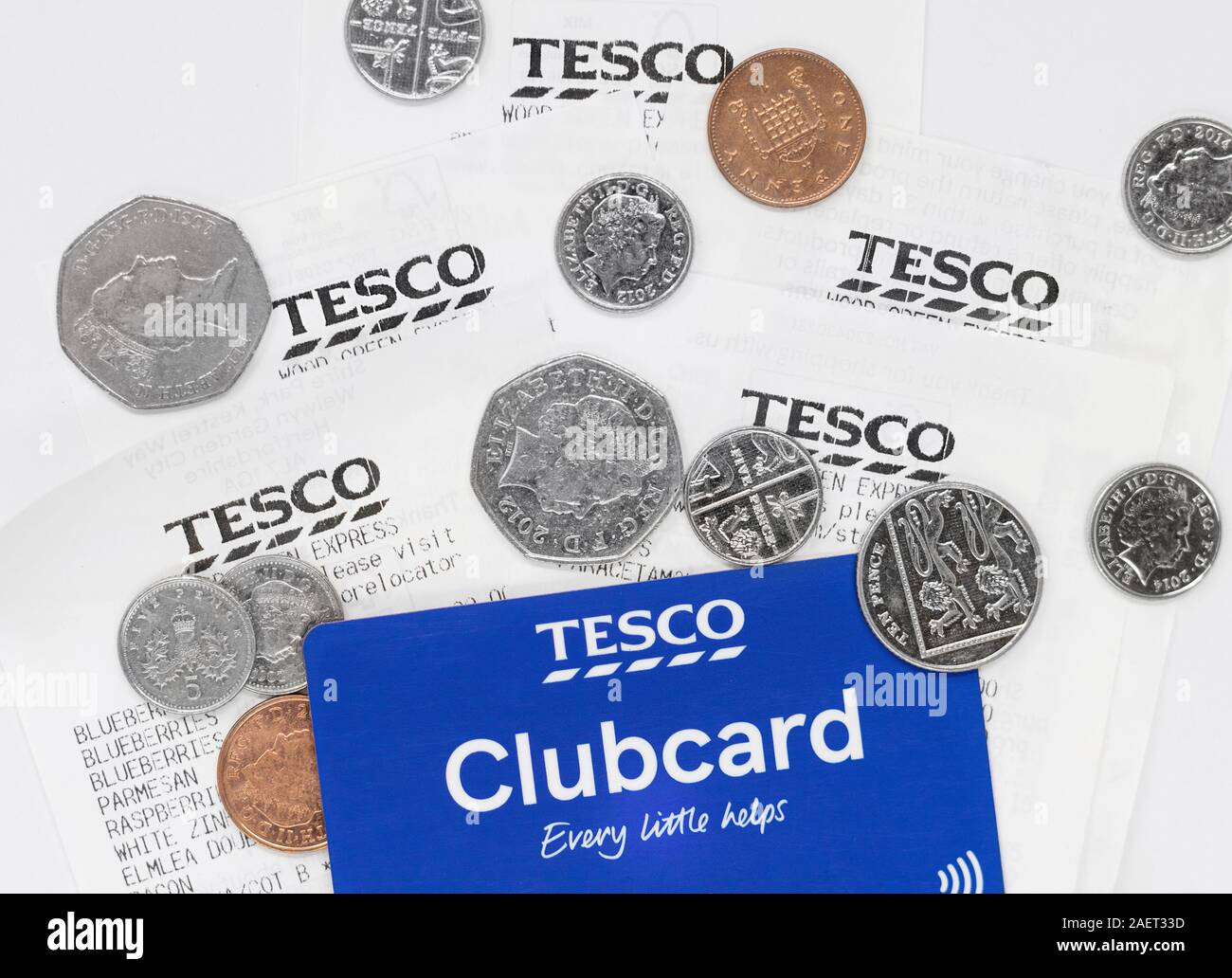 London, UK - December 10th 2019 - Contactless Tesco loyalty card, receipts and money isolated on a white background Stock Photo