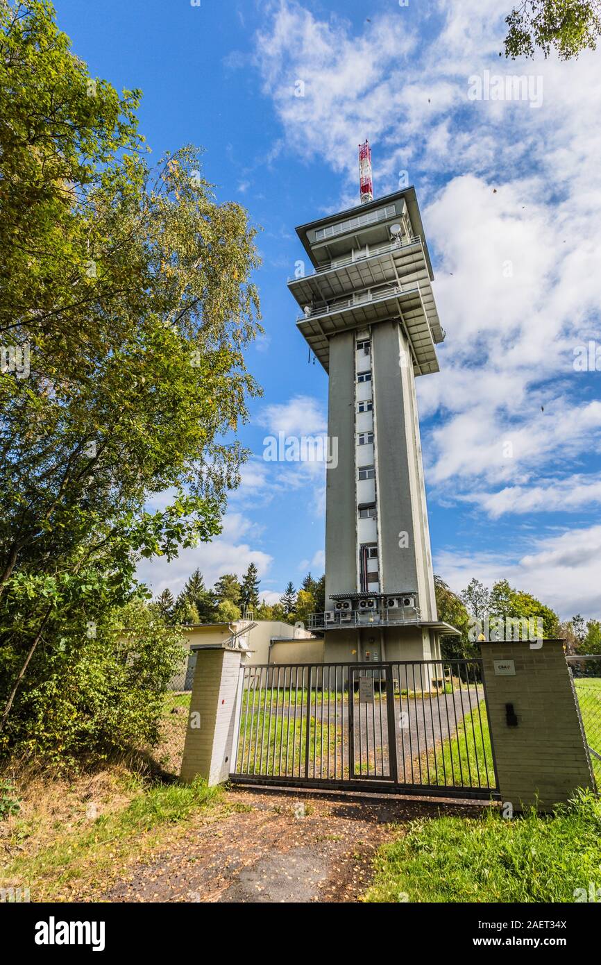 Zelena hora, Pelhrimov / Czech Republic - September 13 2019: Vertical image of television communication tower, a tall grey building on a sunny day. Stock Photo