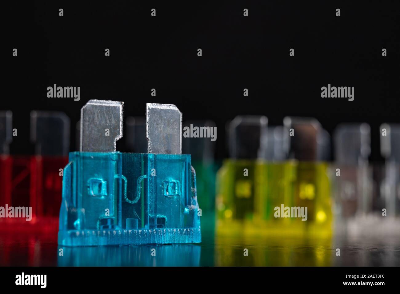 Car fuses on the black table. Car accessories needed to repair the