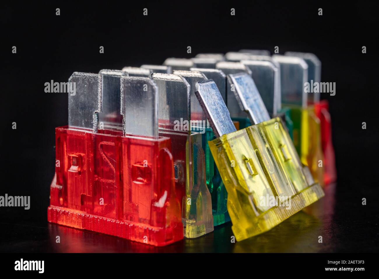 Car fuses on the black table. Car accessories needed to repair the