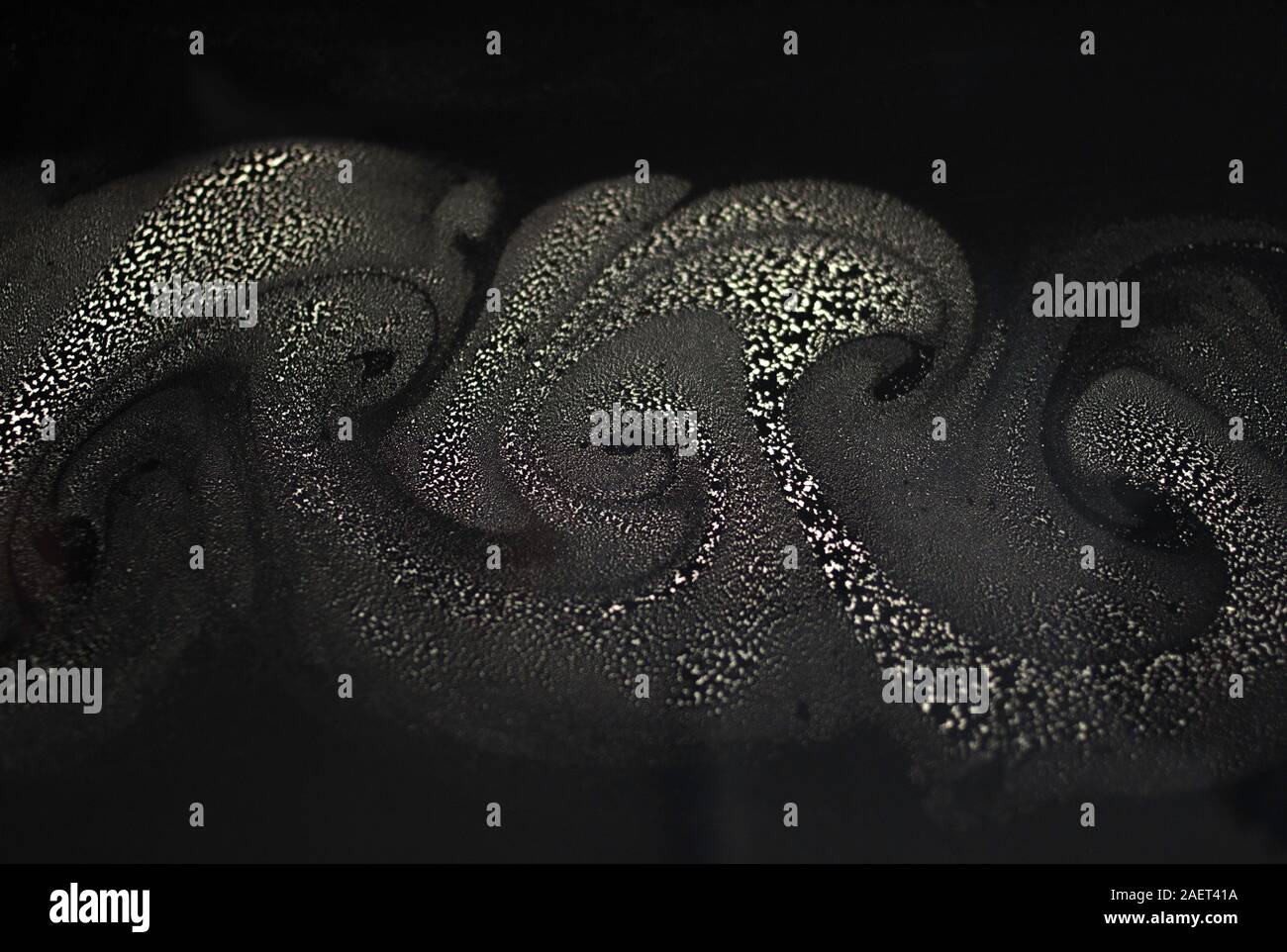 pollen on water hydrodynamic swirls and patterns Stock Photo