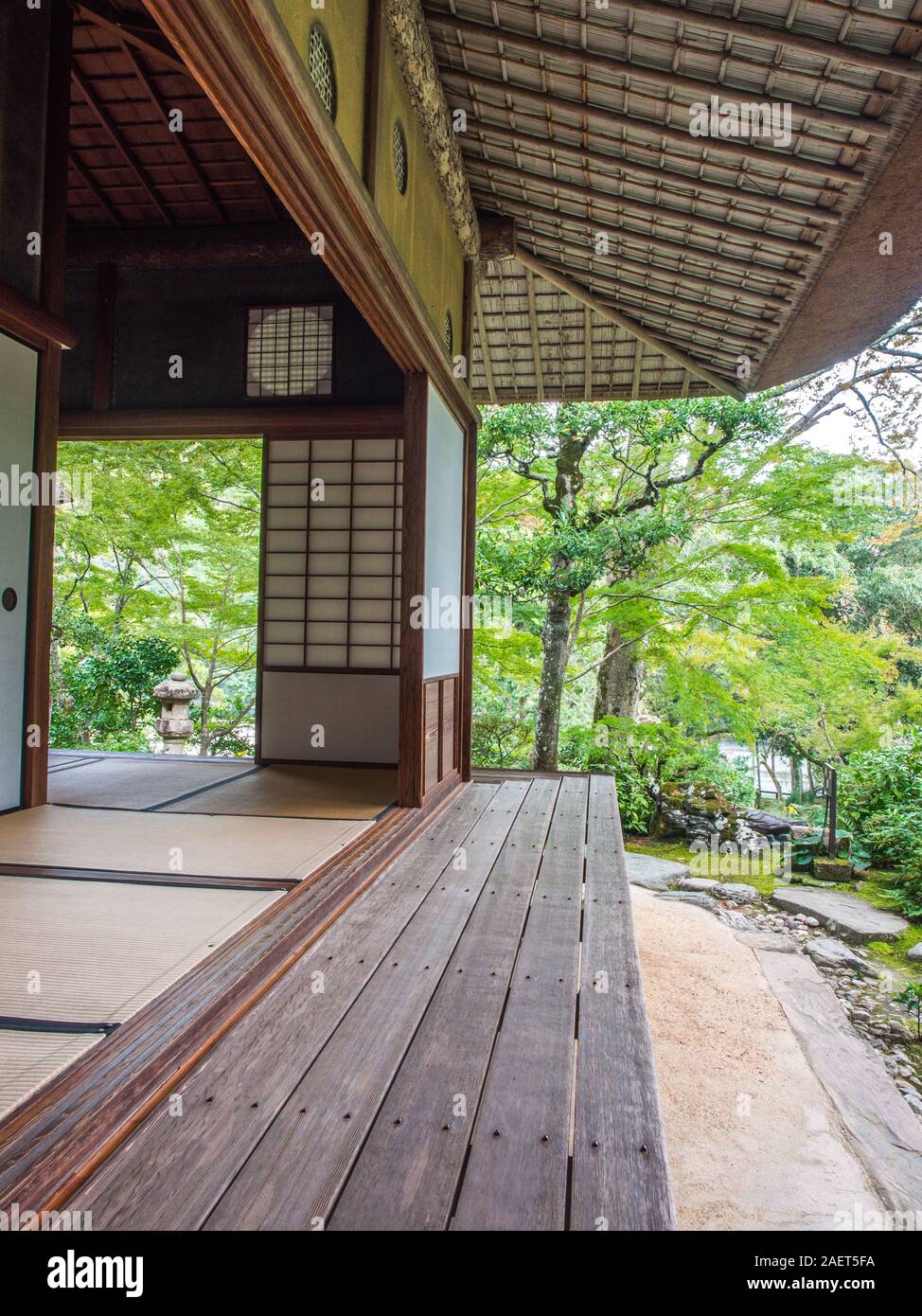 Traditional Japanese garden architecture, wooden verandah, sliding shoji screen wall panels, thatched roof,  Garyuin, Garyusanso, Ozu, Ehime, Shikoku, Stock Photo