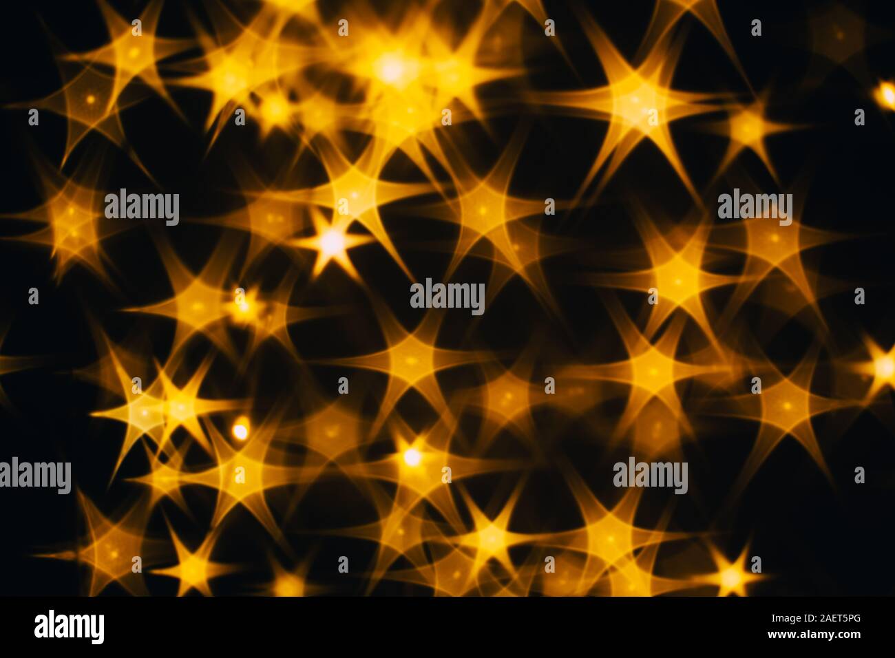 Splash of golden stars on black background Stock Photo - Alamy