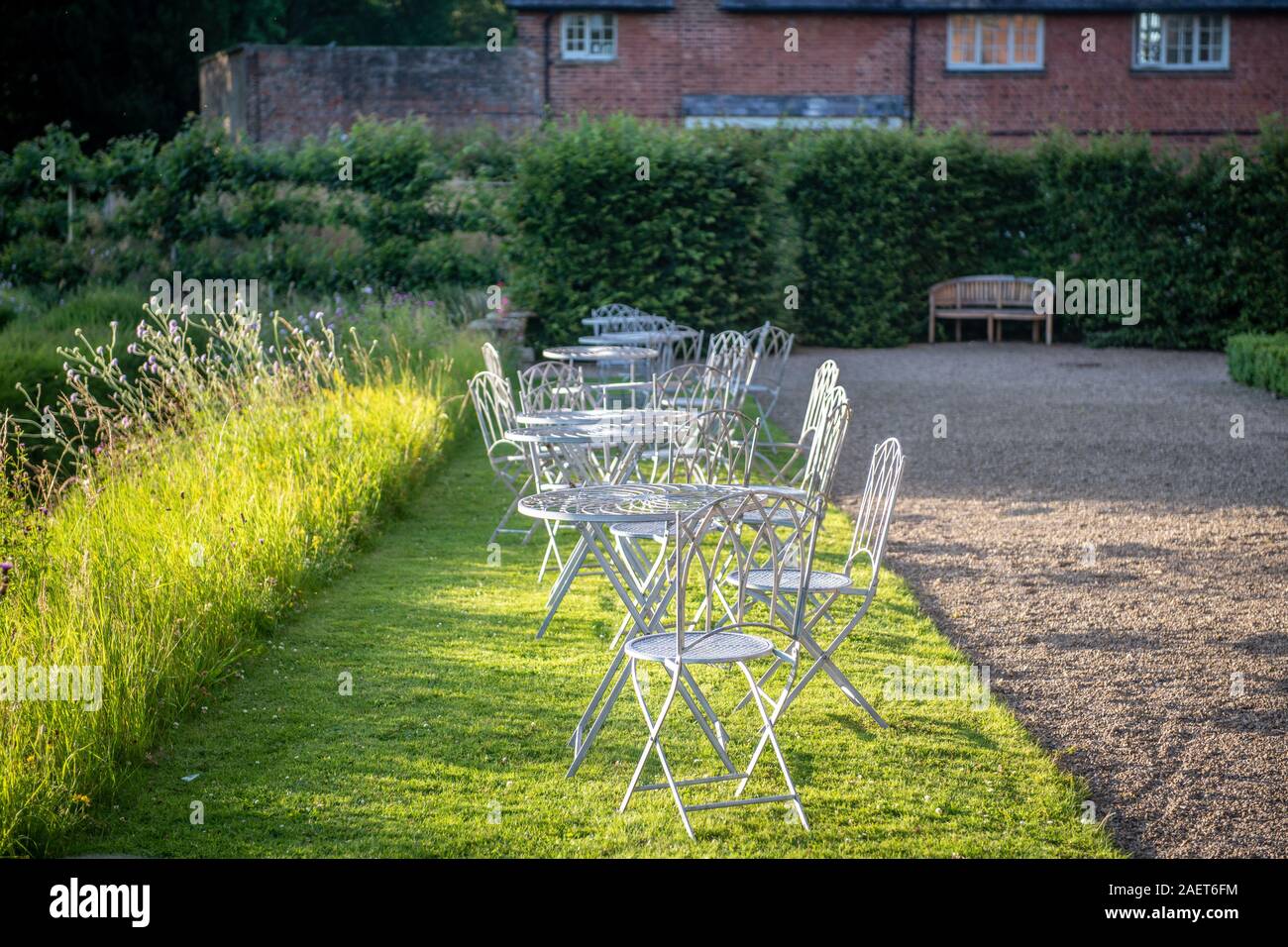 Outdoor seating on the grounds of Kiplin Hall, Yorkshire, United Kingdom. Stock Photo