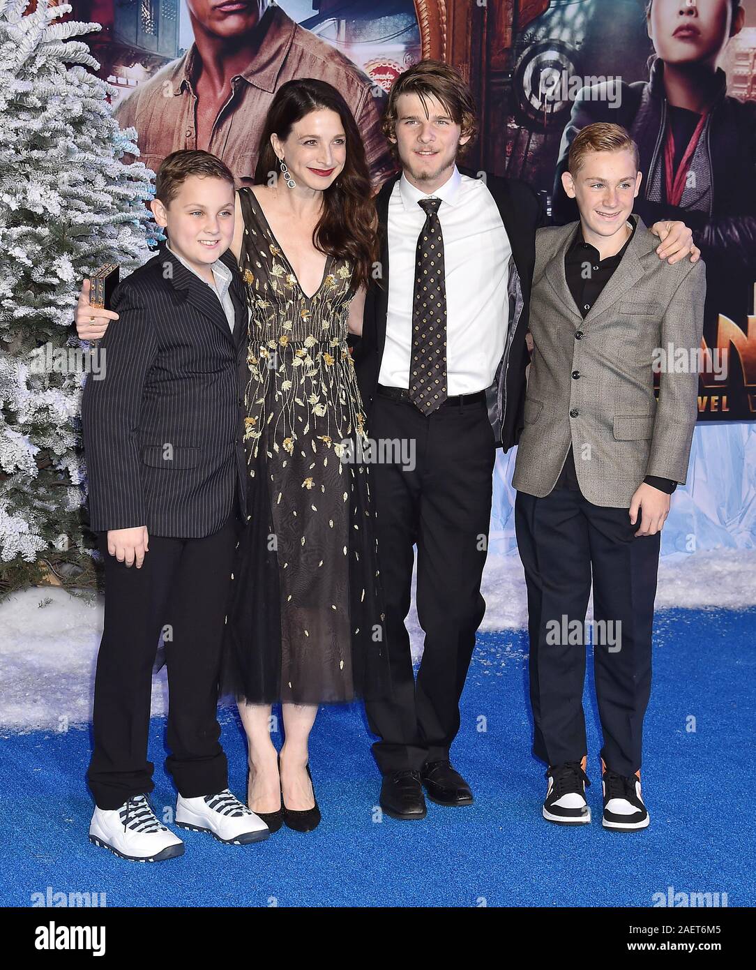 HOLLYWOOD, CA - DECEMBER 09: Marin Hinkle (2nd from L) and guests attend the premiere of Sony Pictures' 'Jumanji: The Next Level' at the TCL Chinese Theatre on December 09, 2019 in Hollywood, California. Stock Photo