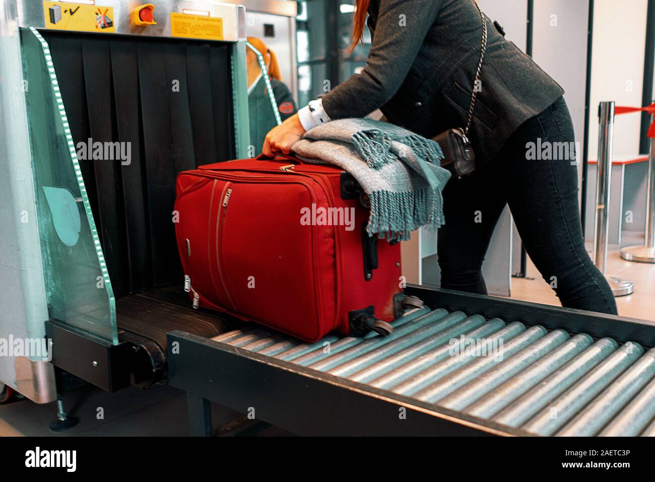x-ray scan in the airport terminal, checking the bags with luggage Stock Photo