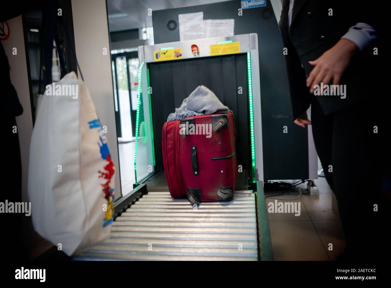 x-ray scan in the airport terminal, checking the bags with luggage Stock Photo