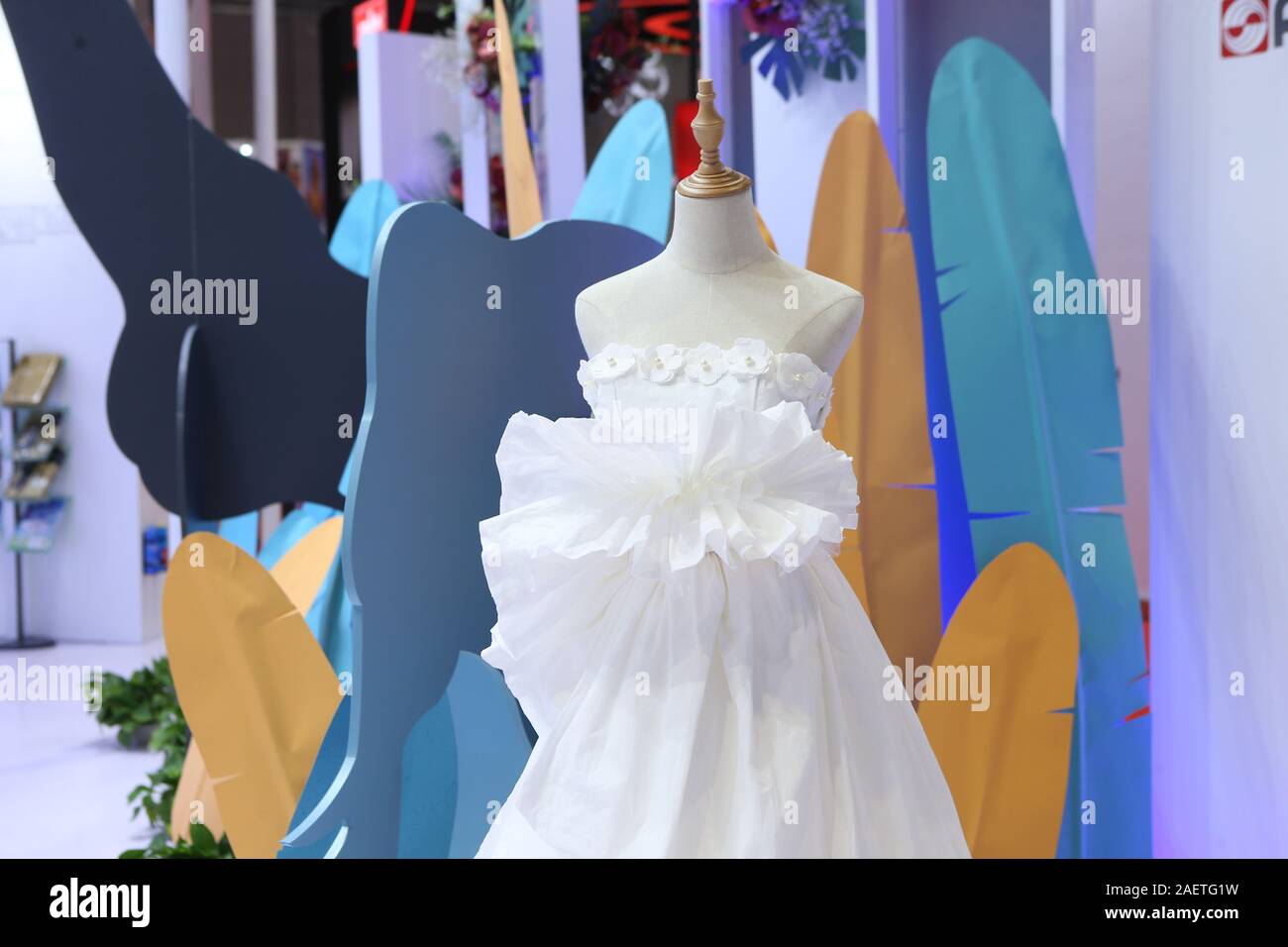 A purely wide wedding dress made of tissue paper is exhibited at a booth of  second China International Import Expo (CIIE) at National Exhibition and C  Stock Photo - Alamy