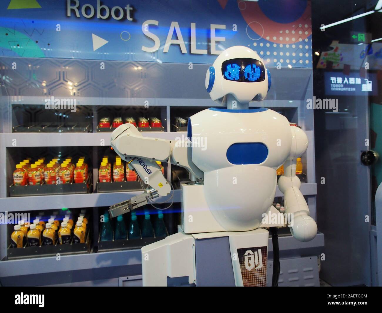 A robot sells drinks at a Robot Sale vendor stall at the China Soong