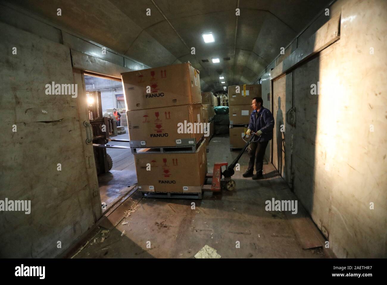 Staff load package on a coach prepared for e-commerce companies to deliver goods in Beijing, China, 8 November 2019.   Special trains for e-commerce c Stock Photo