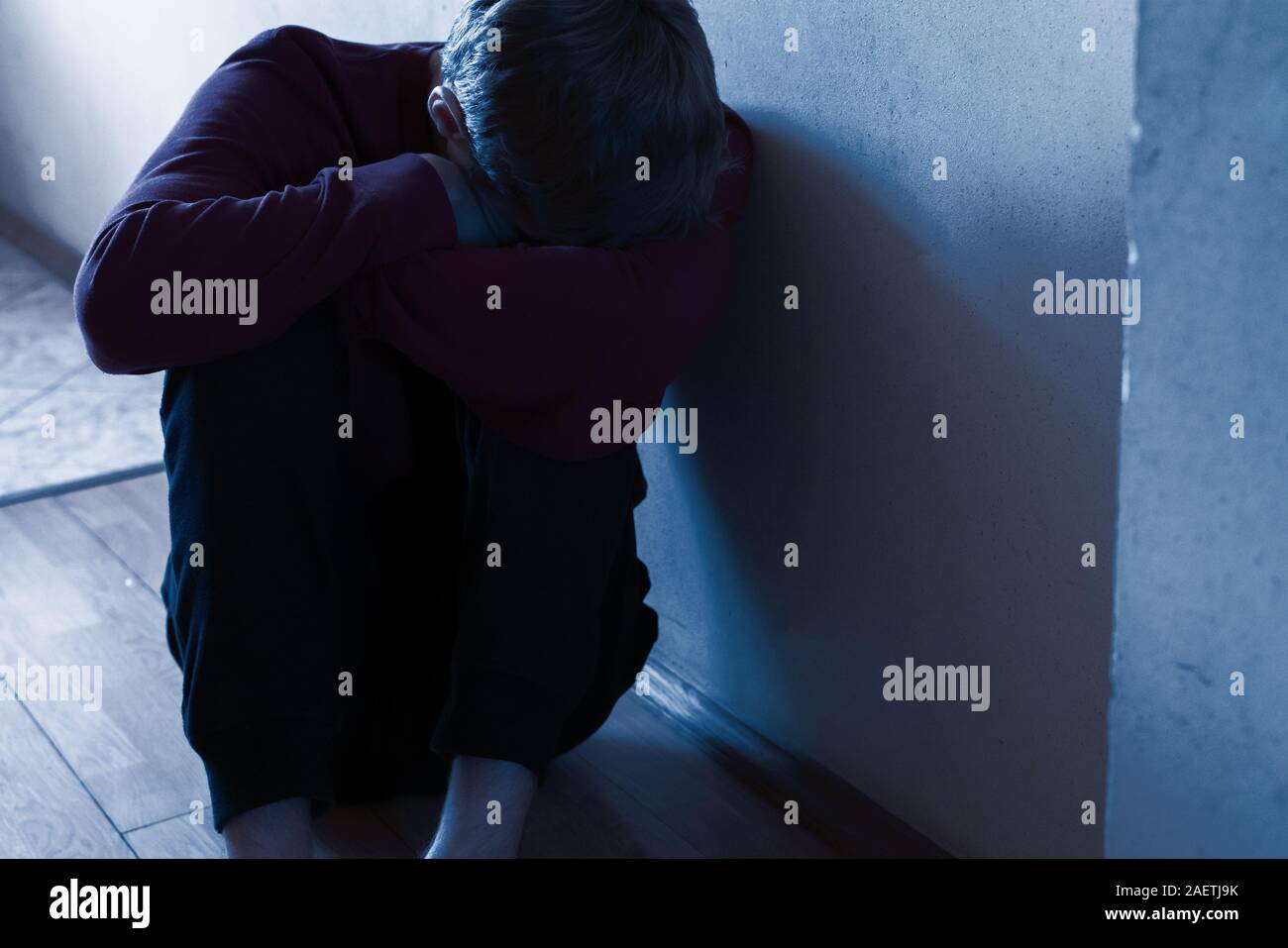 Hopeless person sitting on floor hi-res stock photography and images ...