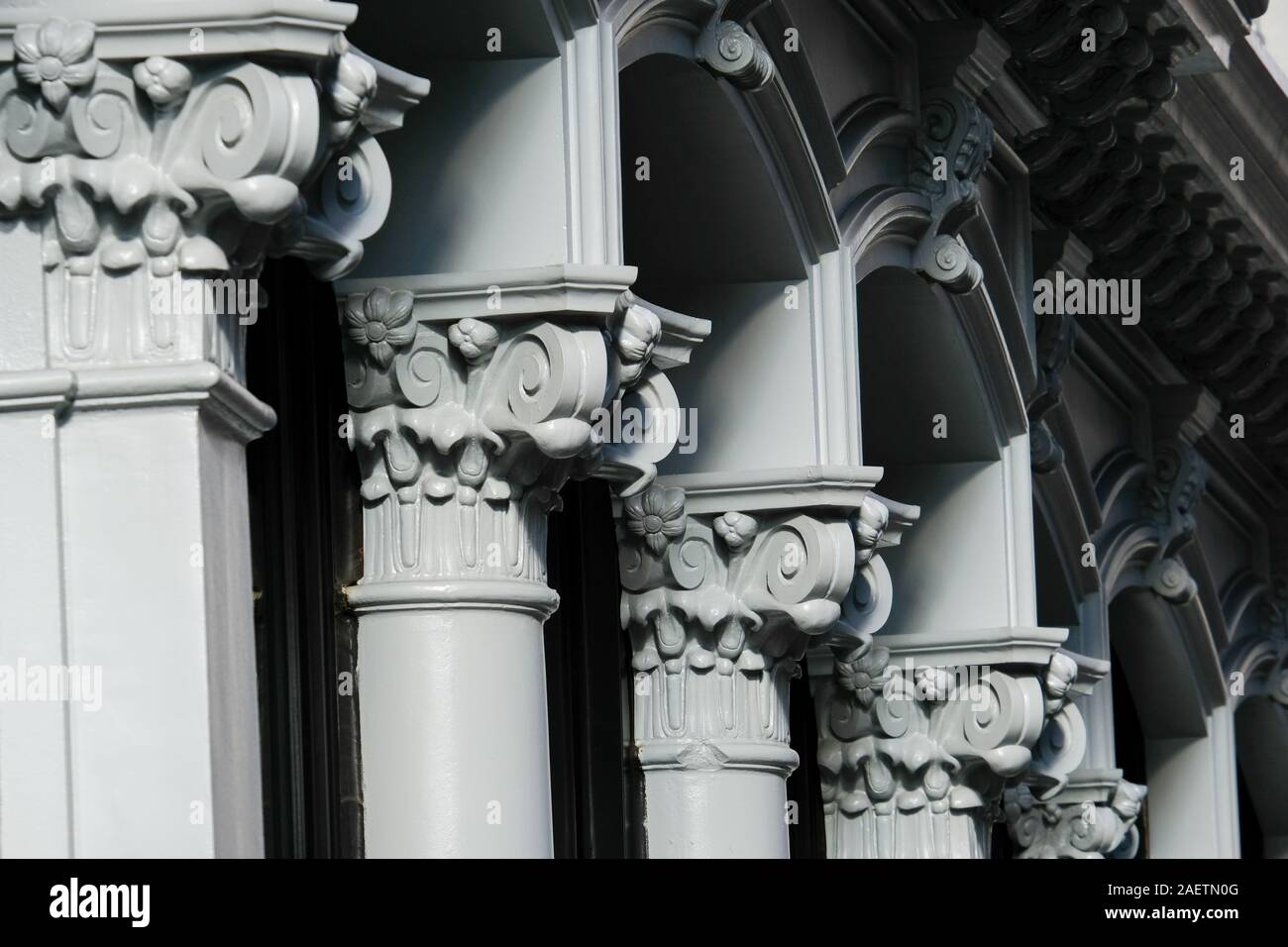 Cast iron Corinthian columns on building facade on Broadway, New York City. Stock Photo