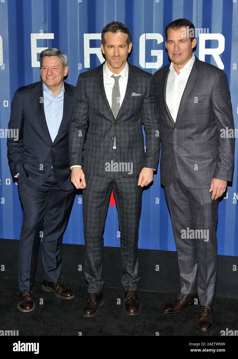 New York, USA. 10th Dec, 2019. L-R: Netflix exec Ted Sarandos, actor Ryan Reynolds and Netflix exec Scott Stuber attend the NY premiere of 6 Underground at The Shed at Hudson Yards in New York, NY on December 10, 2019. (Photo by Stephen Smith/SIPA USA) Credit: Sipa USA/Alamy Live News Stock Photo