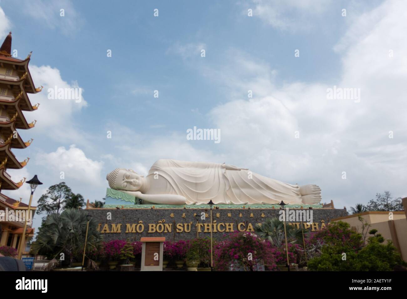 A giant statue of a lying down Buddha at Vinh Trang pagoda in southern