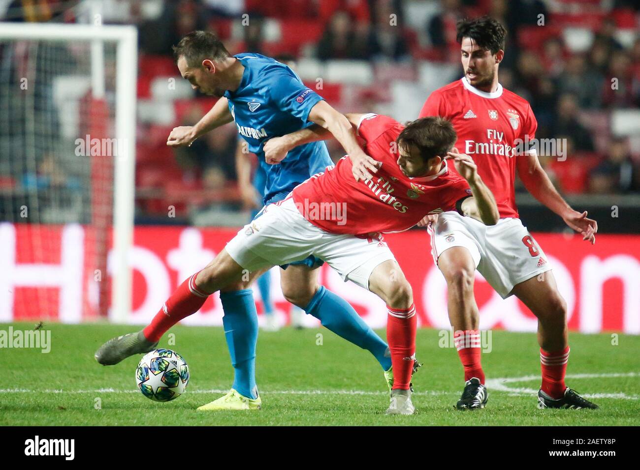 Saint Petersburg, Russia. 10th Dec, 2019. Chiquinho (Francisco Leonel Lima Silva Machado) (C) of Benfica and Artem Dzyuba (L) of Zenit are seen in action during the UEFA Champions League group G match between SL Benfica Lisbon and Zenit at Gazprom Arena in St. Petersburg.(Final score; SL Benfica Lisbon 3:0 Zenit) Credit: SOPA Images Limited/Alamy Live News Stock Photo