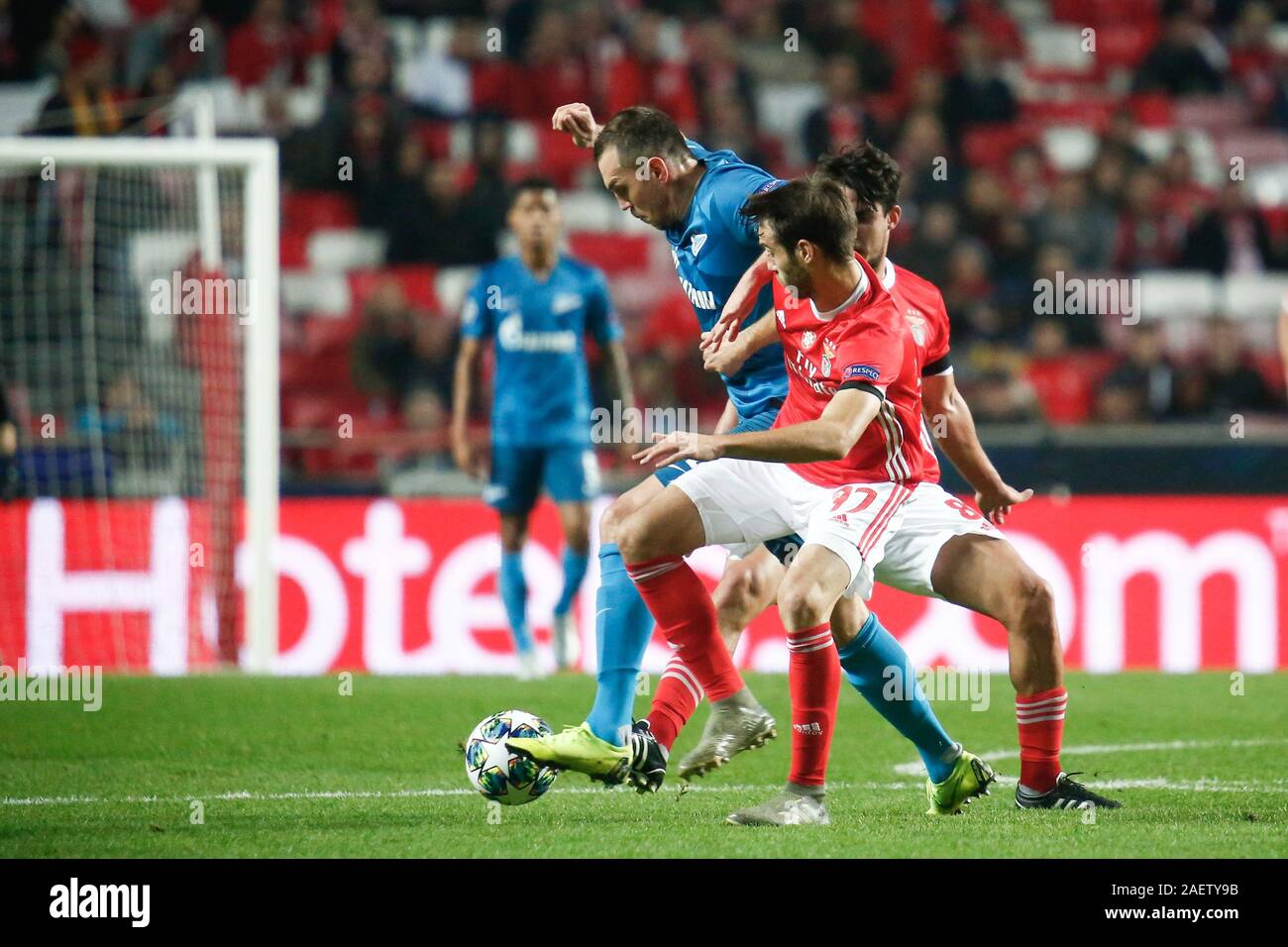 Saint Petersburg, Russia. 10th Dec, 2019. Chiquinho (Francisco Leonel Lima Silva Machado) (C) of Benfica and Artem Dzyuba (L) of Zenit are seen in action during the UEFA Champions League group G match between SL Benfica Lisbon and Zenit at Gazprom Arena in St. Petersburg.(Final score; SL Benfica Lisbon 3:0 Zenit) Credit: SOPA Images Limited/Alamy Live News Stock Photo