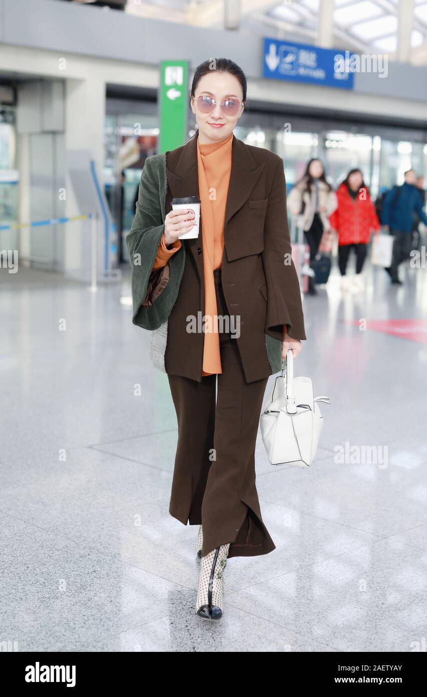 Chinese actress Tao Hong or Helen Tao arrives at a Beijing airport in