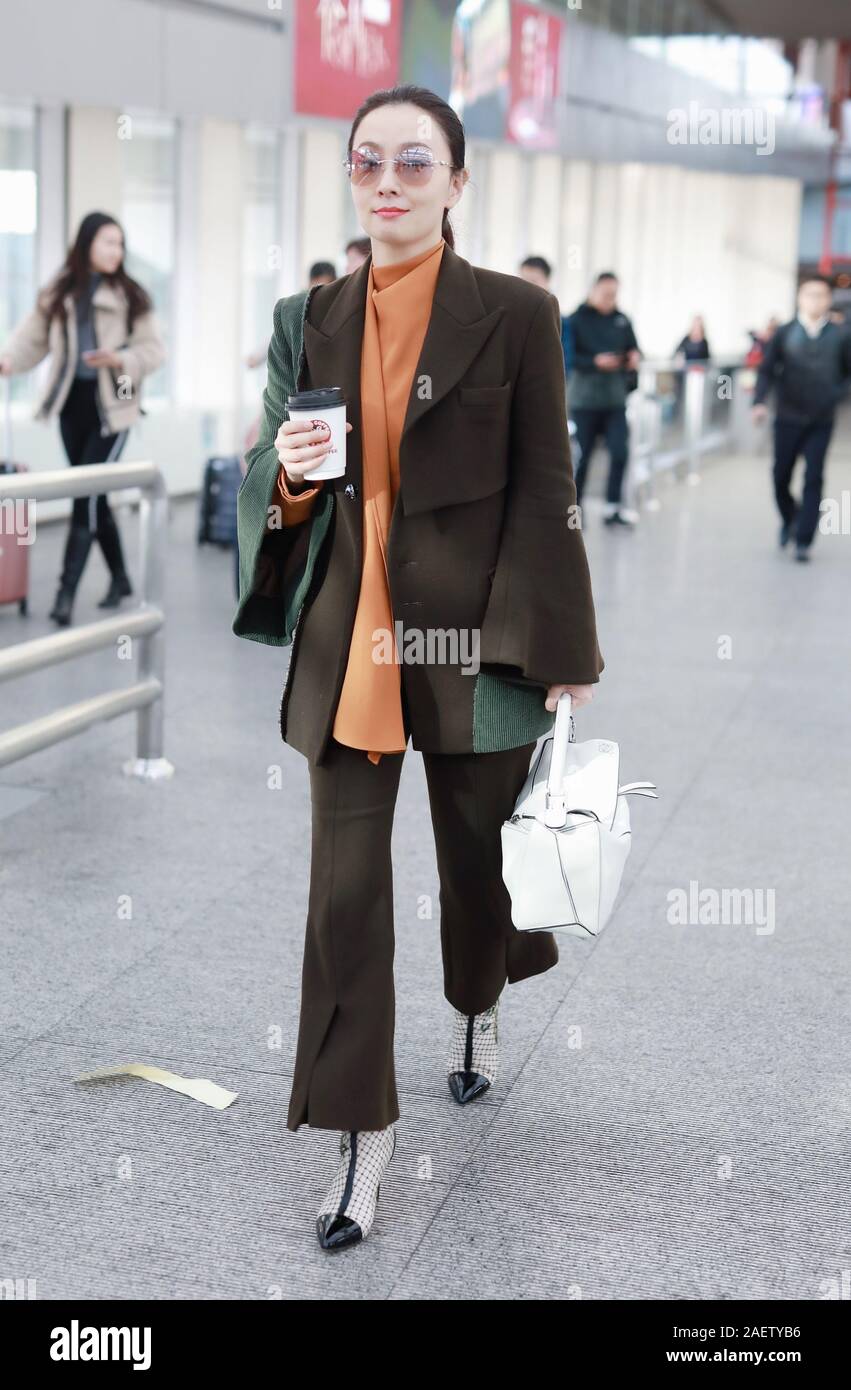 Chinese actress Tao Hong or Helen Tao arrives at a Beijing airport in ...