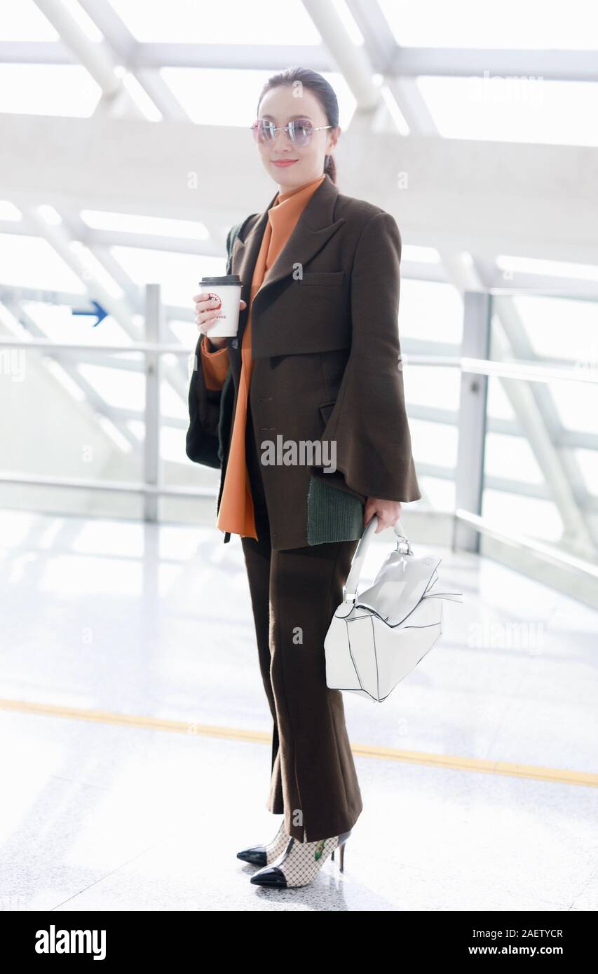 Chinese actress Tao Hong or Helen Tao arrives at a Beijing airport in