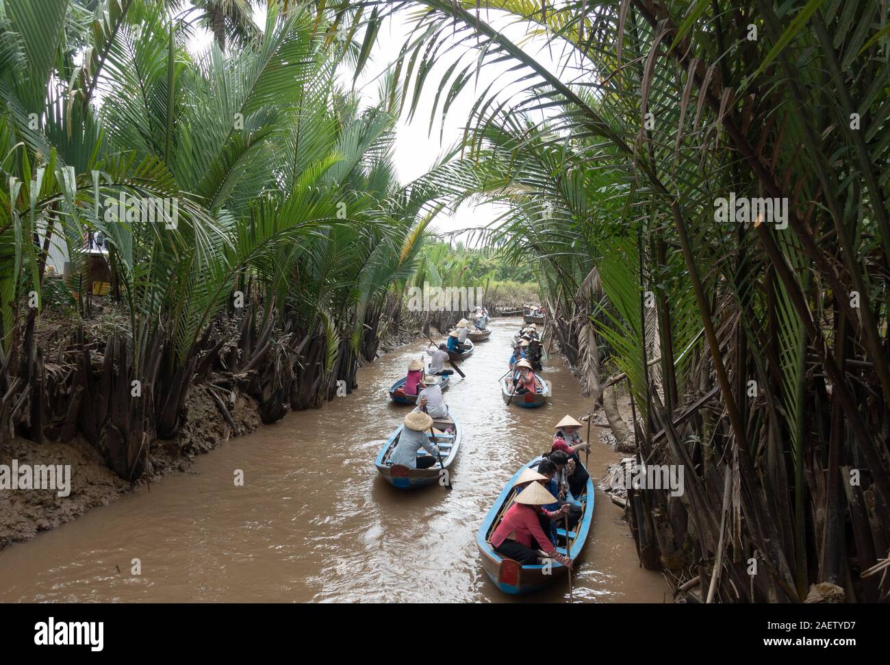 Boats of tourists are paddled down the Mekong Delta in southern Vietnam ...