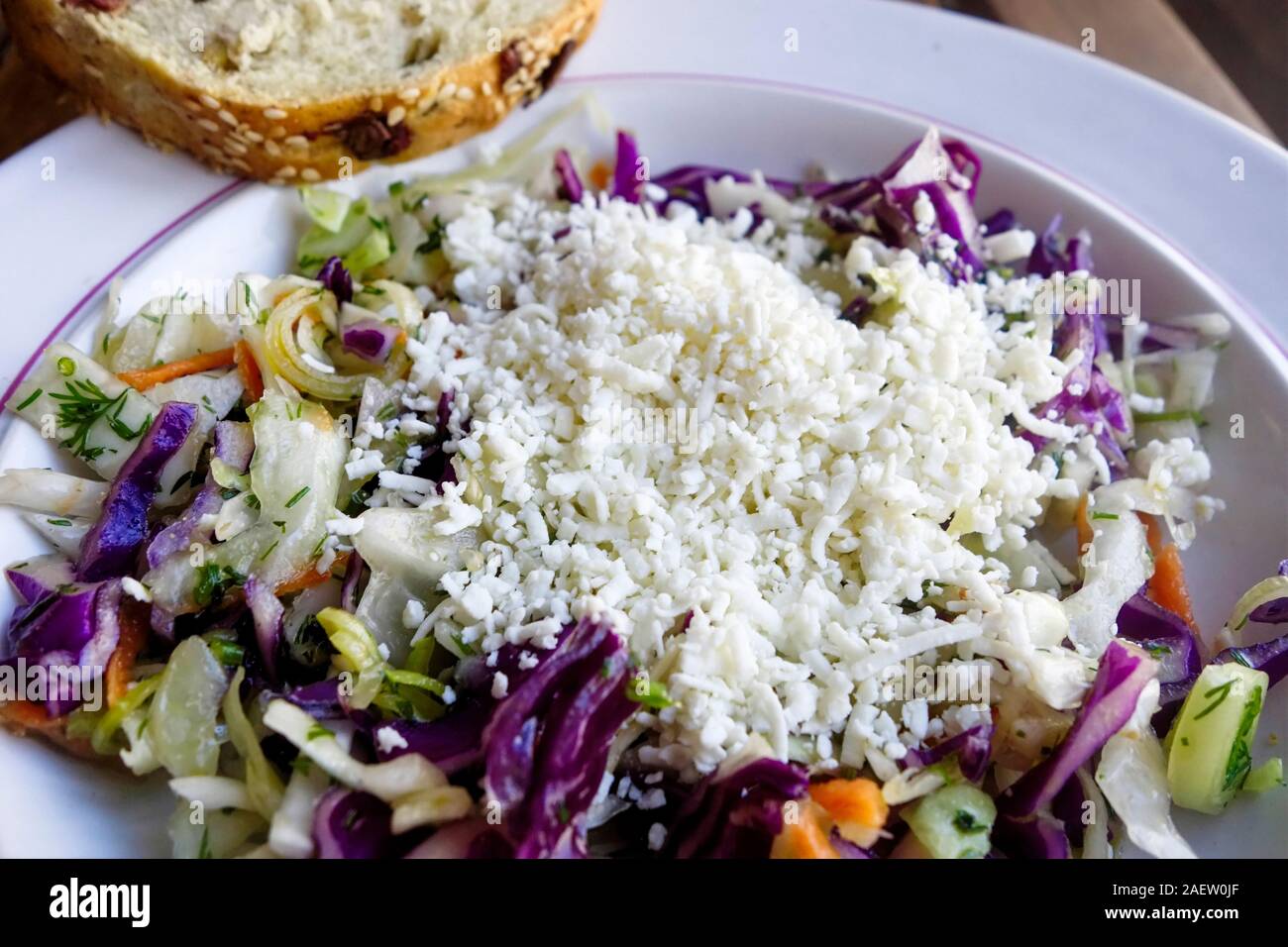 Greek Cuisine. Goat and Sheep Cheese Mixed Vegetable Salad with Olive Bread Stock Photo
