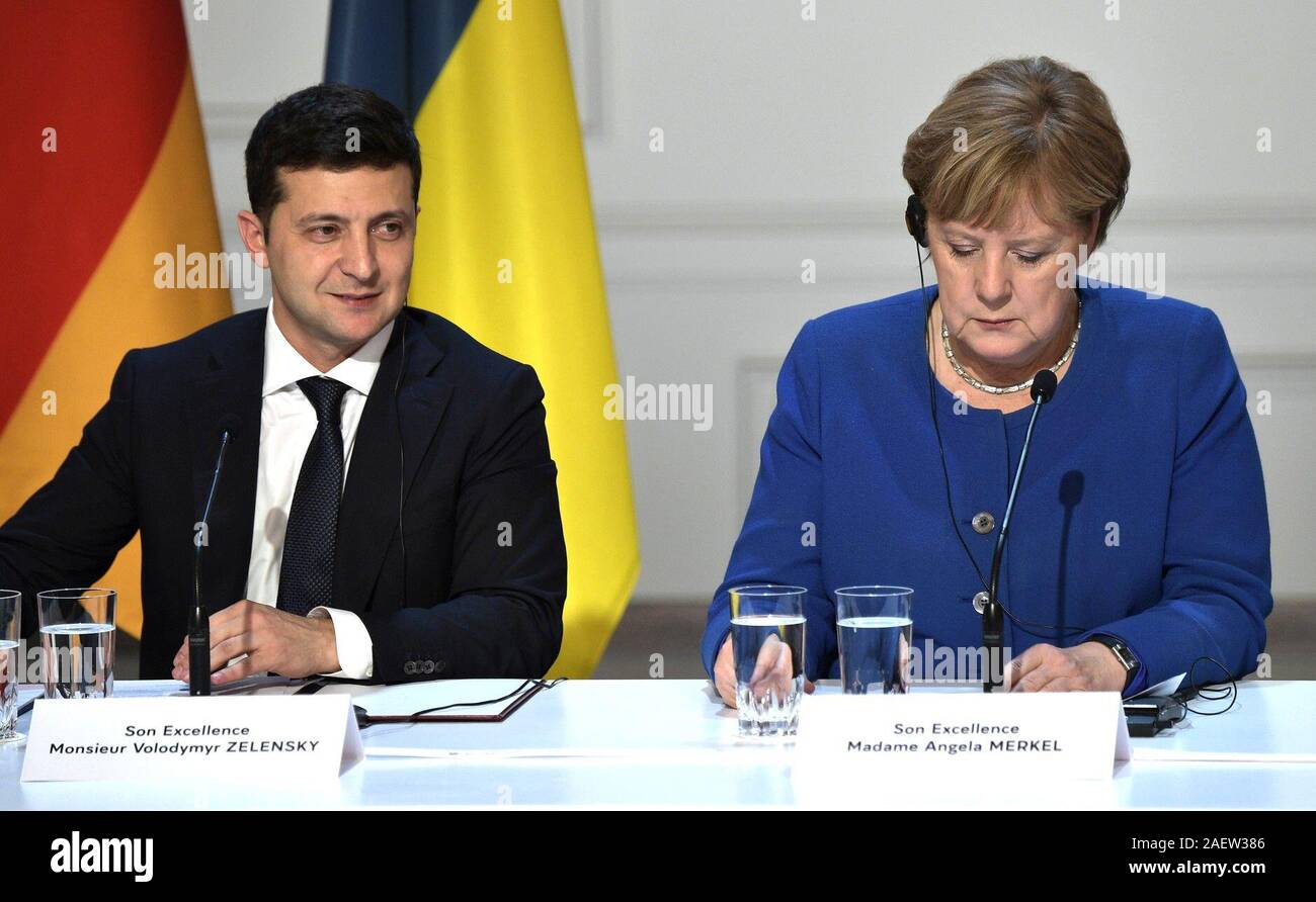 December 10, 2019. - France, Paris. - Ukraine's President Volodymyr Zelensky (left) and Germany's Chancellor Angela Merkel give a news conference after a Normandy Four summit at the Elysee Palace. Stock Photo
