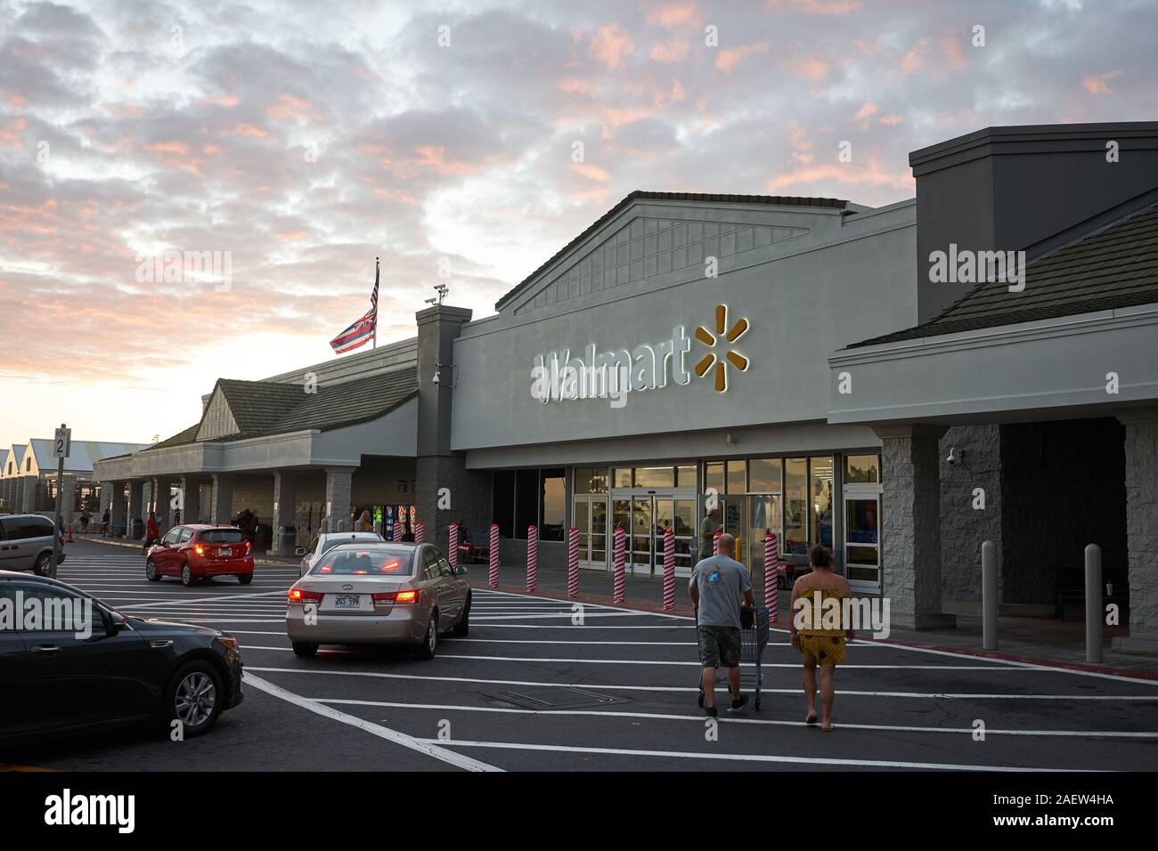 Shoppers outside a Walmart store in Kailua-Kona, on the Bid Island, Hawaii, seen at dusk on Thursday, Nov 28, 2019. Stock Photo