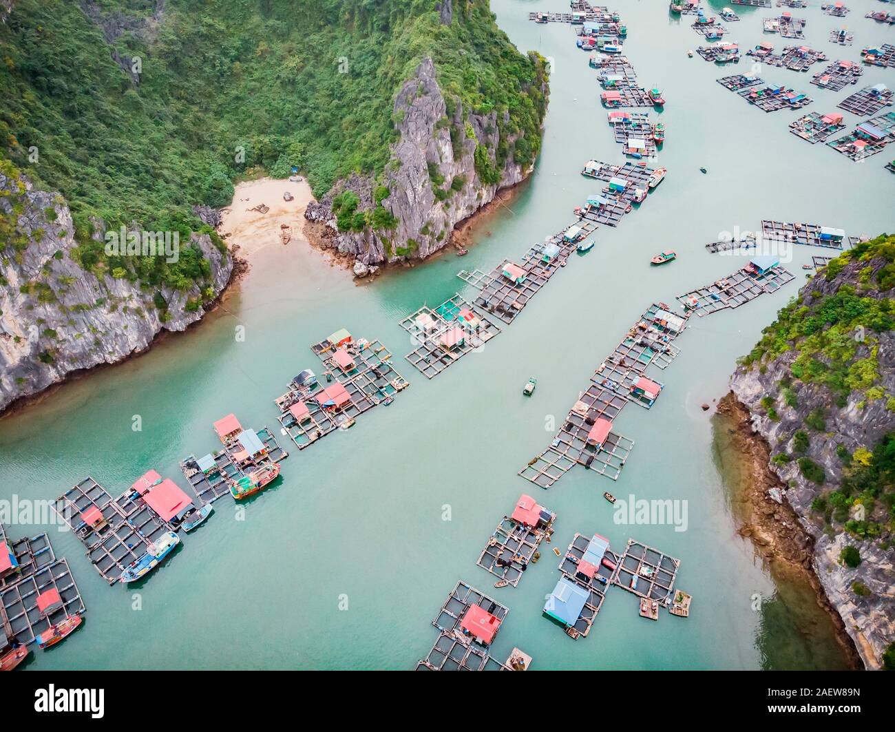 Aerial view of floating villages around Cat Ba islands. Cat Ba is the largest of the 366 islands, which make up the southeastern edge of Ha Long Bay i Stock Photo