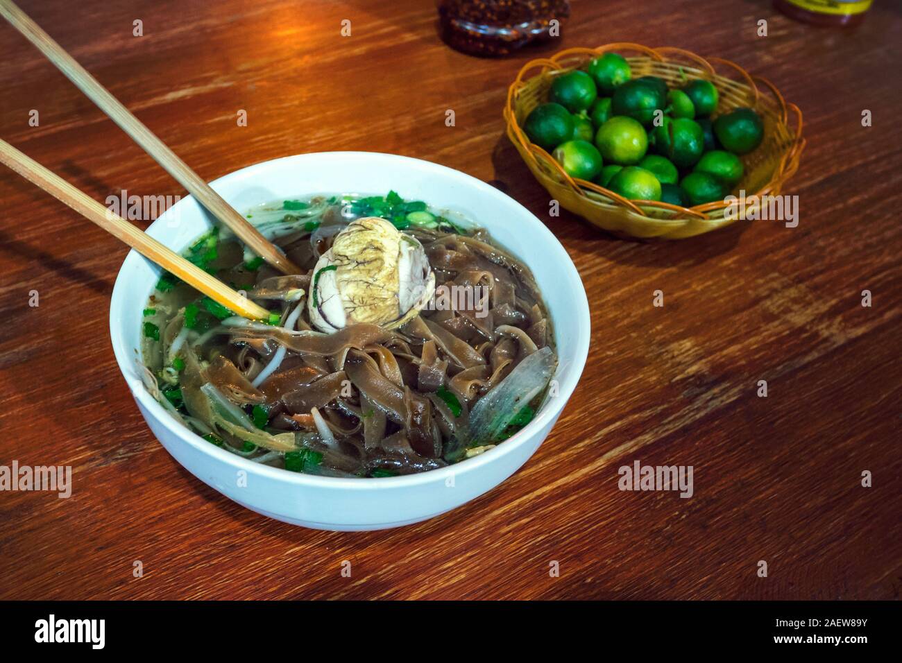 Balut boiled developing duck embryo is a special cuisine in Asia. it's very popular in Philippine, Vietnam, Lao and Cambodia. An exotic soup with Pho Stock Photo