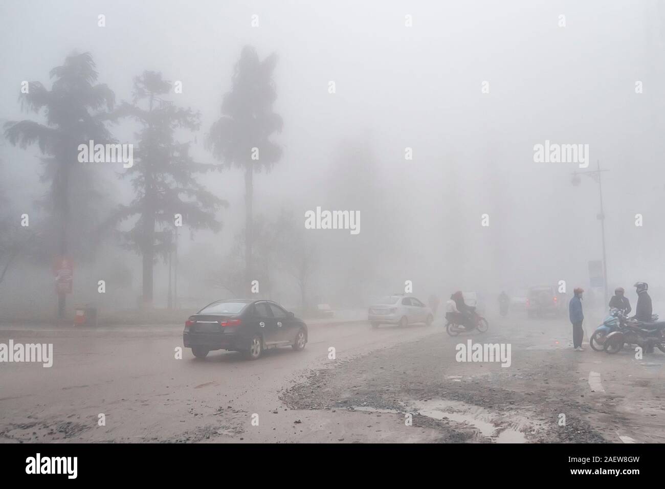 Beautiful city view of sapa city with fog in morning, sapa, vietnam Stock Photo