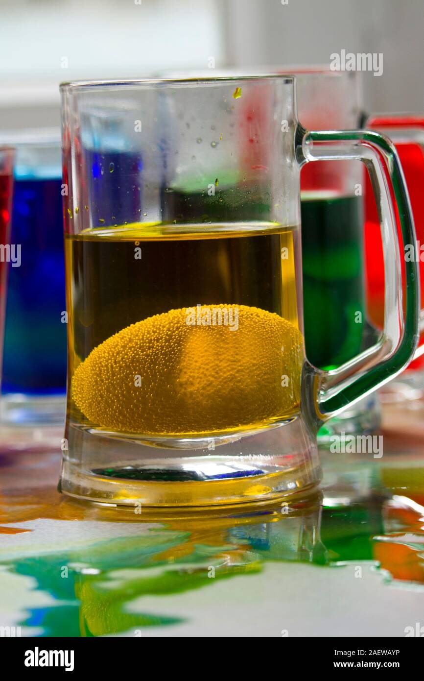 Glasses with paint for Easter eggs. Easter Egg decorating. Close up, soft focus Stock Photo