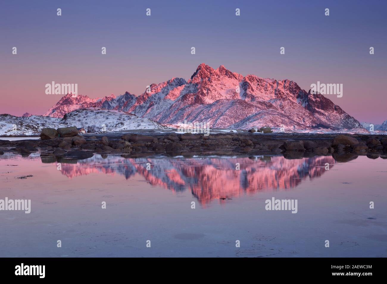 Mountain peaks reflected in the water on the Lofoten in northern Norway at sunset. Stock Photo
